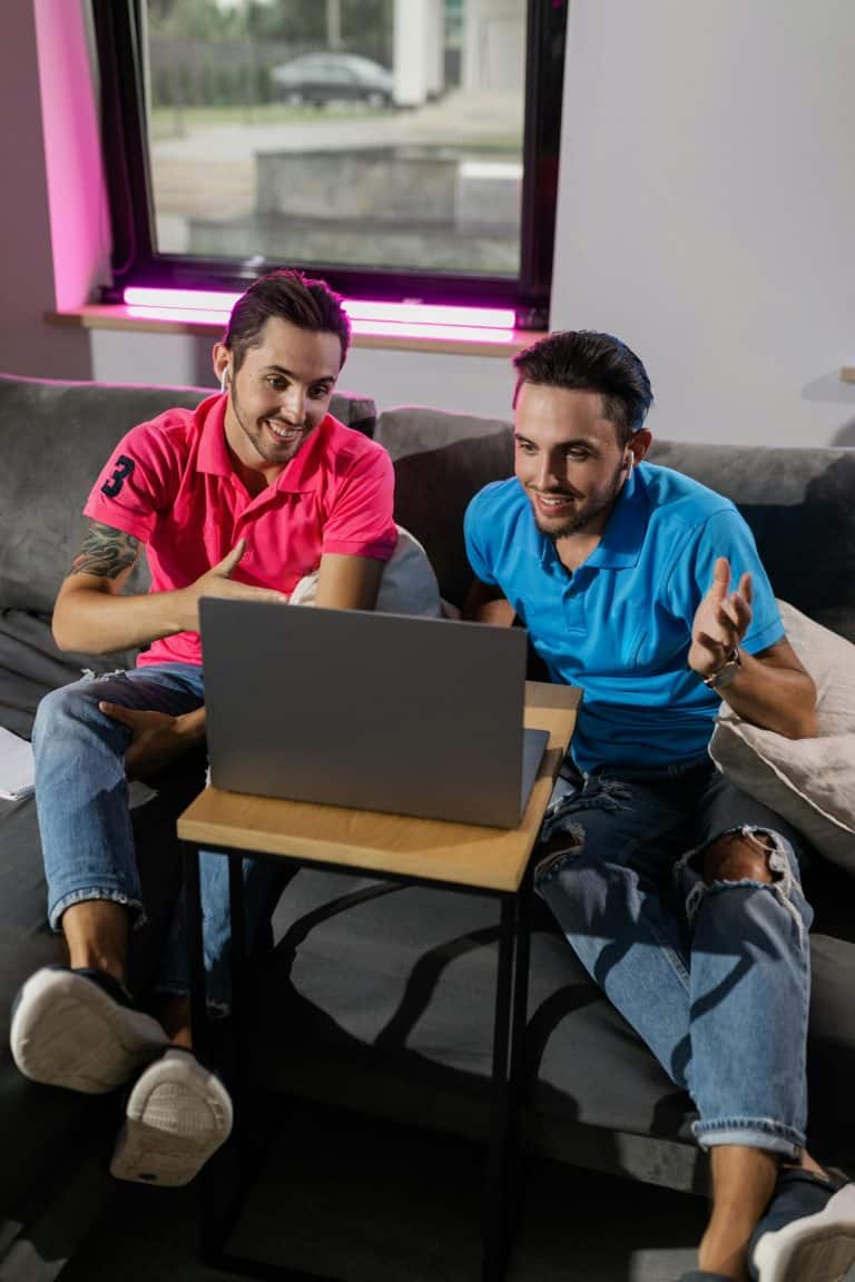 Two friends video chatting on a laptop