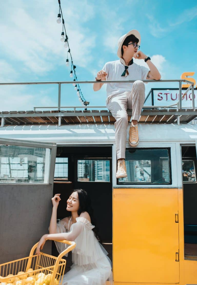 Cheerful scene at Retro Lemon CafÃ© with a yellow bus, lemons, and playful figures.