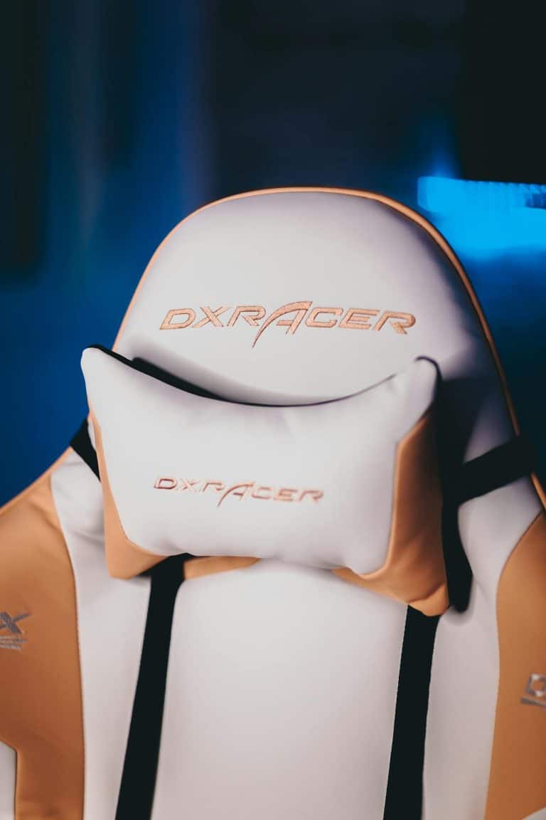 Sleek ergonomic white and orange gaming chair for ultimate comfort during gaming and work sessions.