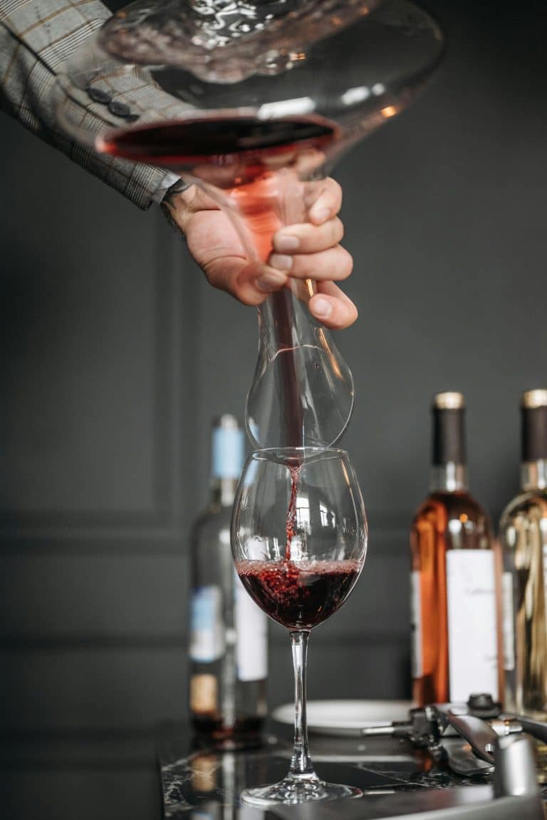 Sophisticated wine pouring into an elegant glass, showcasing the art of wine tasting.