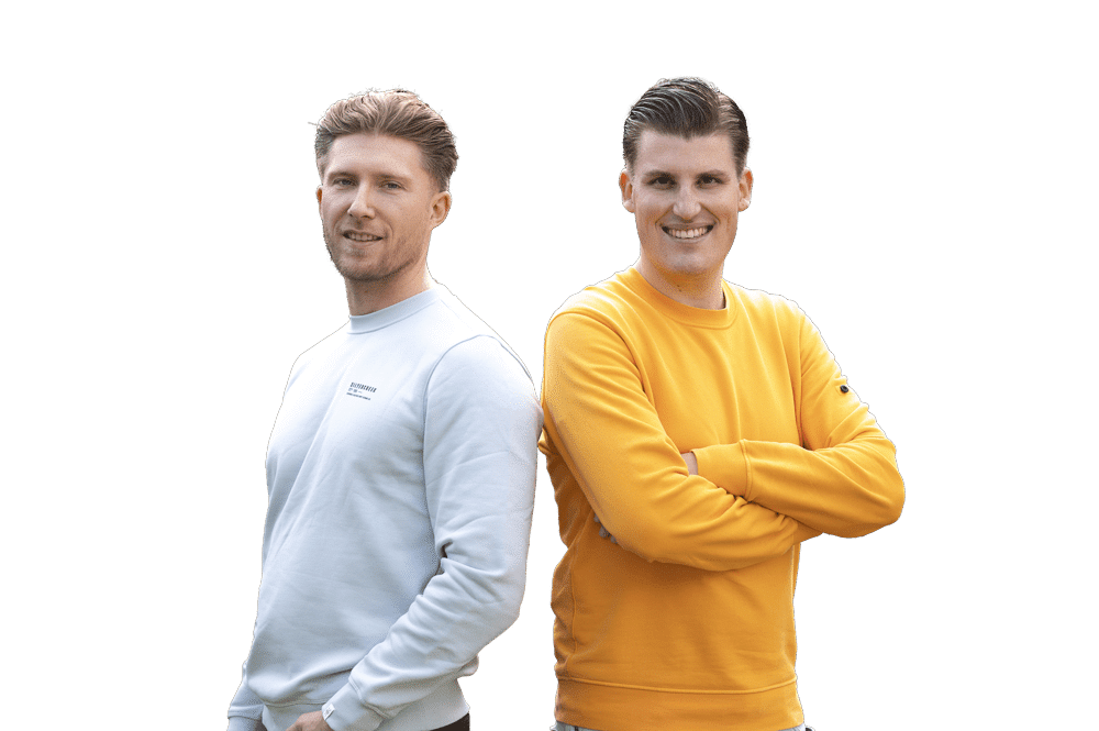 Two men smiling in casual sweaters