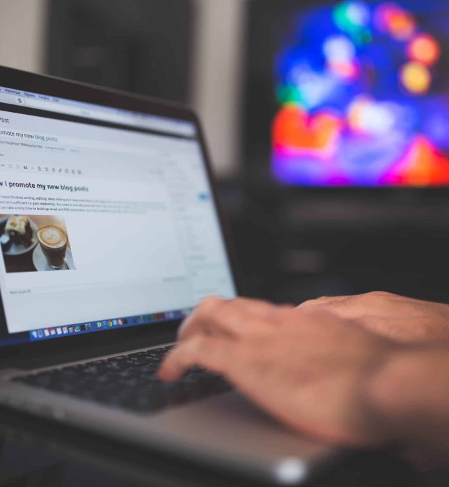 Close-up of a laptop using WordPress in a vibrant, inspiring creative workspace.