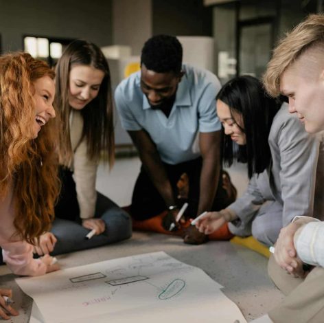 Dynamic brainstorming session among a diverse team in a modern creative workspace.