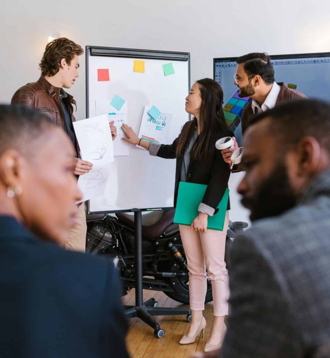 Dynamic business meeting in a modern office, fostering collaboration and innovation through engaging presentations.