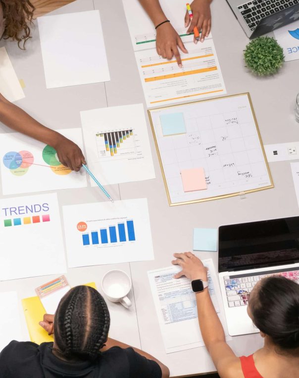 Diverse team collaborates in a vibrant workspace, discussing data-driven marketing strategies and innovative ideas.