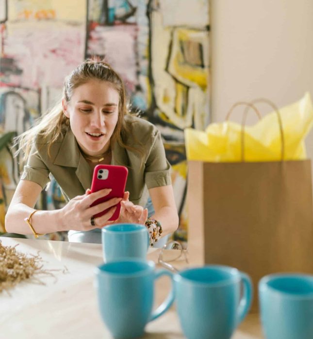 Cozy gathering with friends, light blue mugs, and a creative atmosphere celebrating connection and joy.