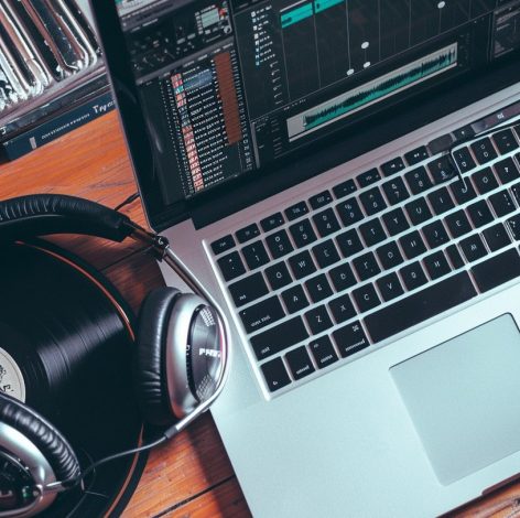 Sleek music production workspace blending modern technology with vintage elements for creative audio projects.