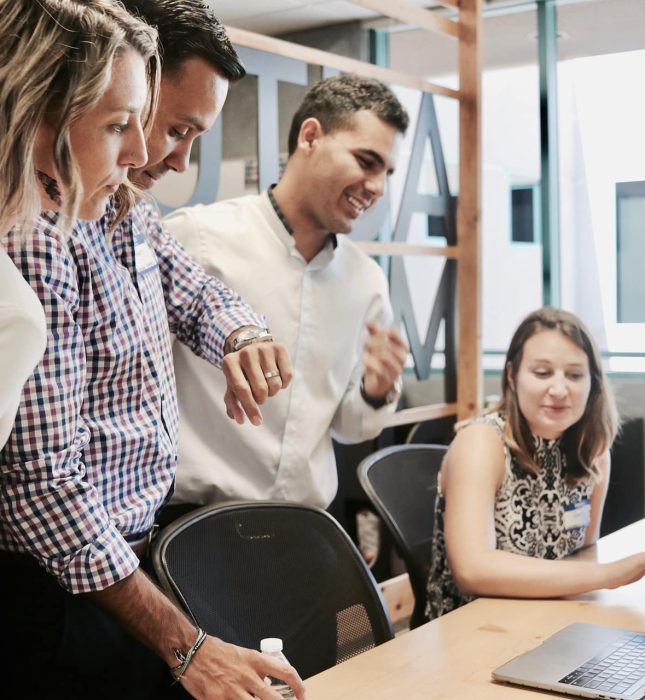 Engaged team collaboration in a bright, modern office setting fosters creativity and productivity.